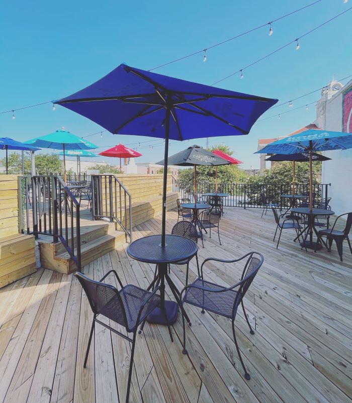 Outdoor commercial patio seating with umbrellas